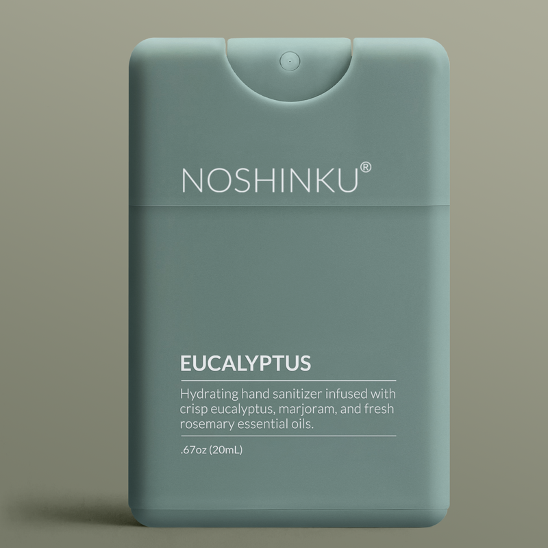 Noshinku Hydrating Eucalyptus pocket hand sanitizer pocket sprayer on a green background